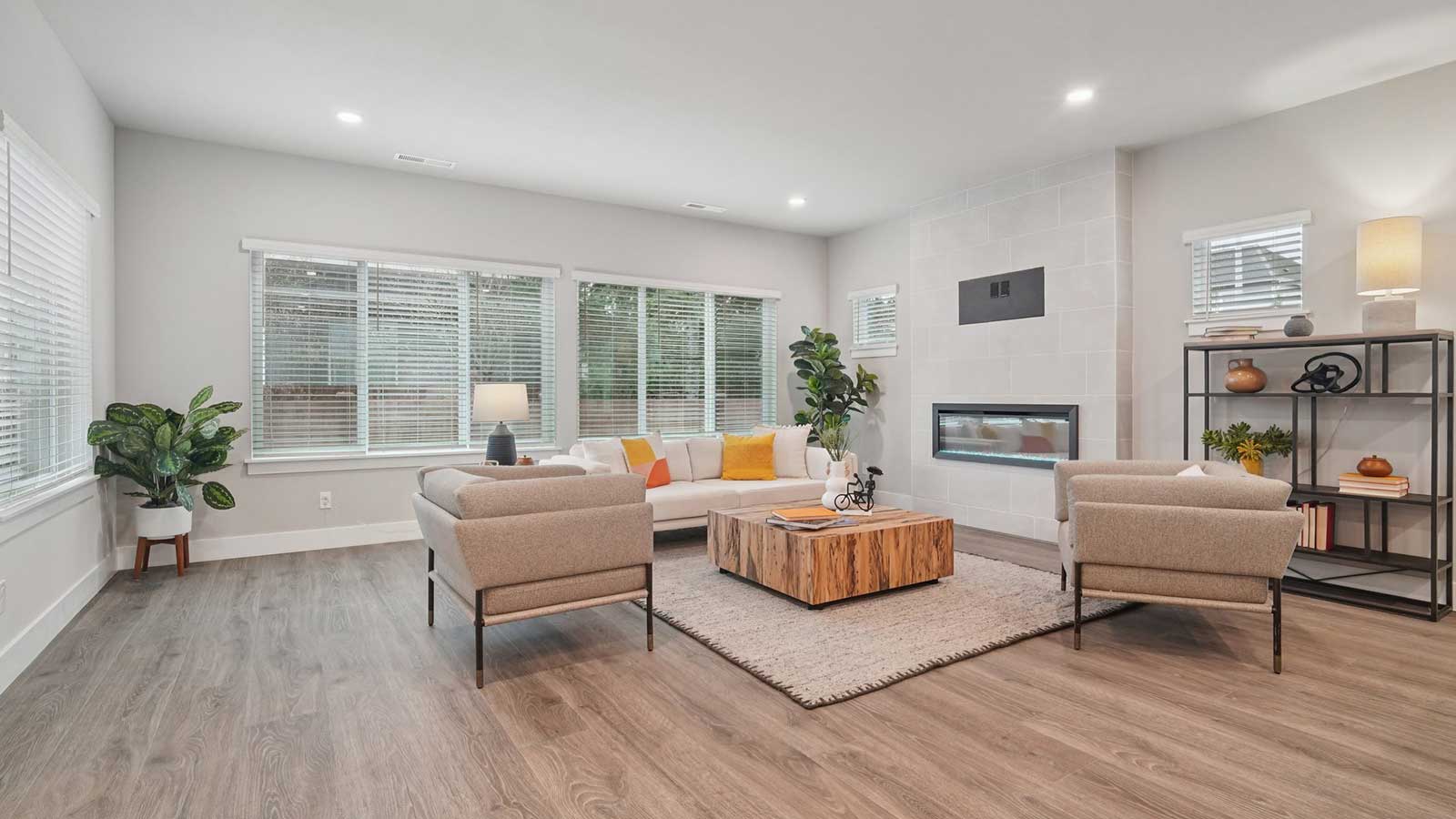Walking in to the open-concept living, dining and kitchen