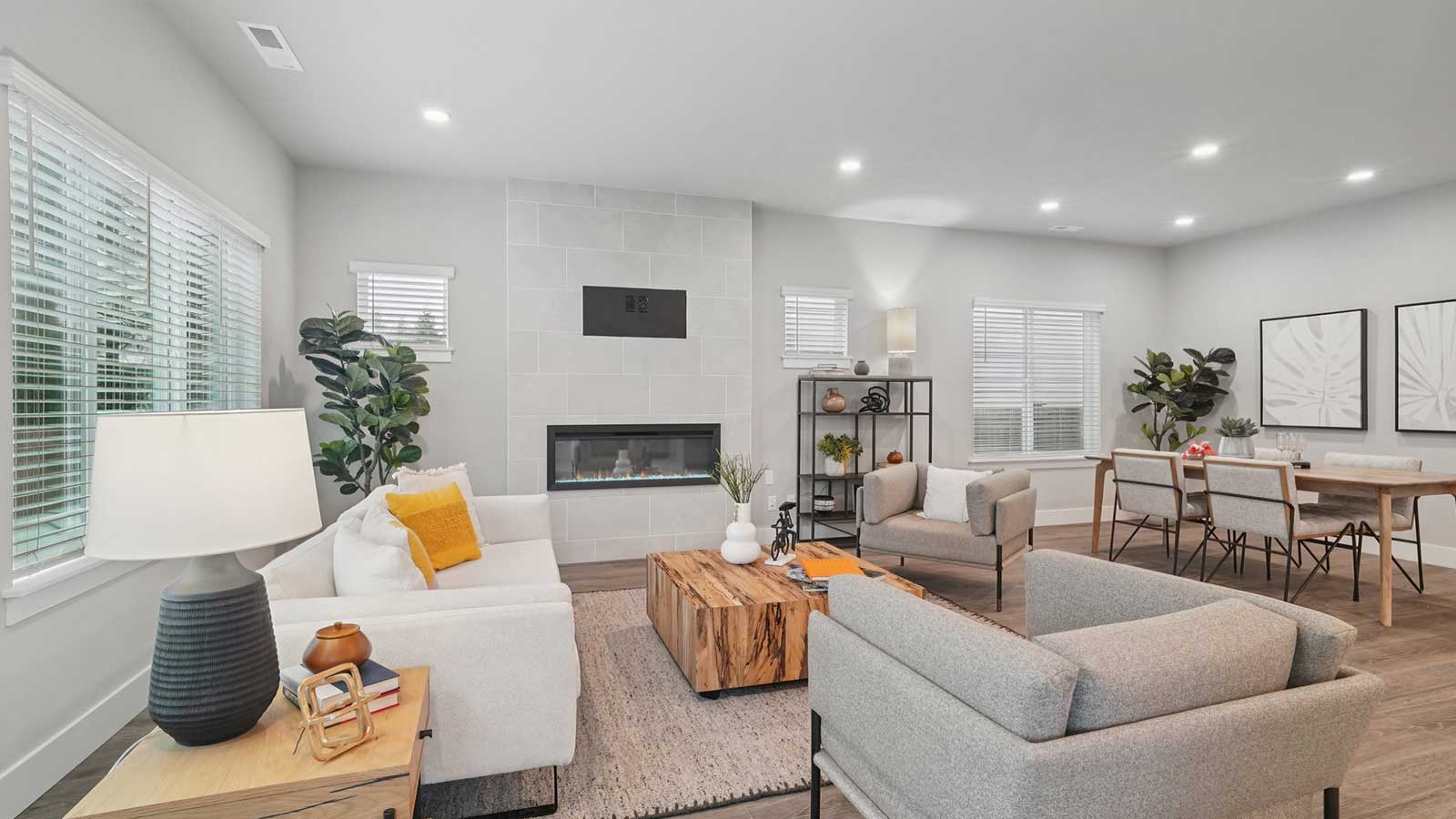 Another view of dining and living space with cozy electric fireplace