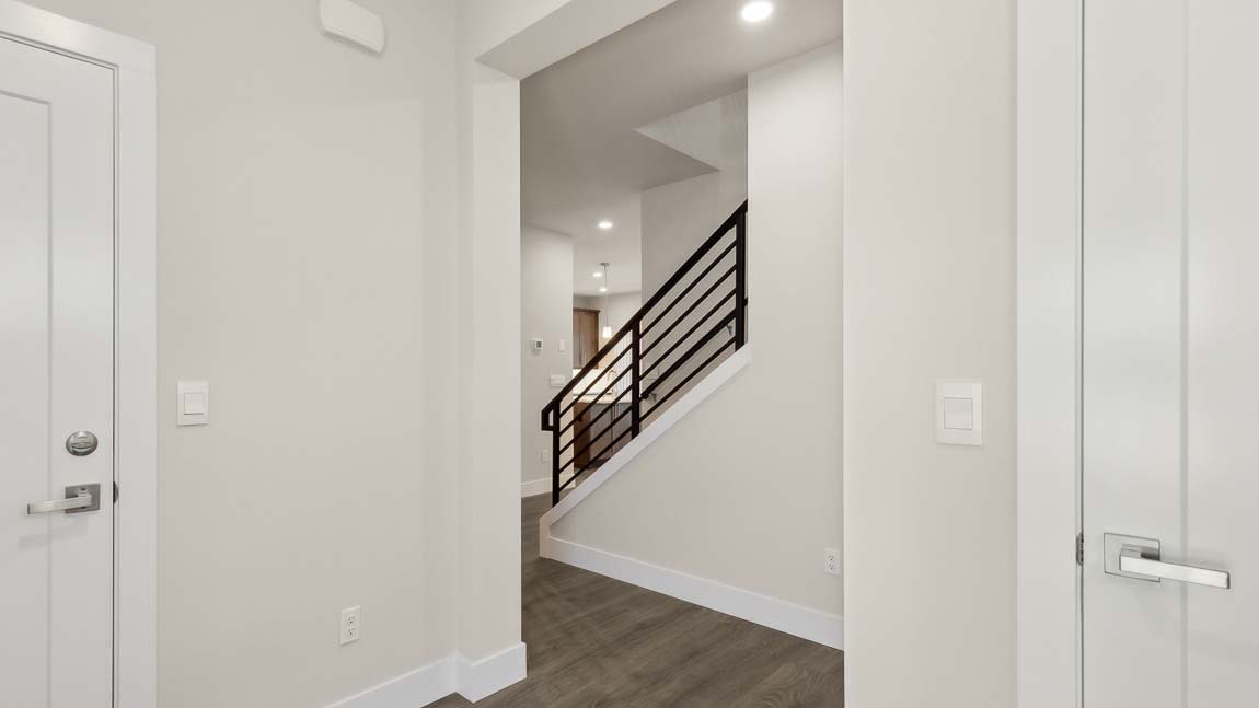 Entry of Rainier floor plan flowing access to garage and entry closet