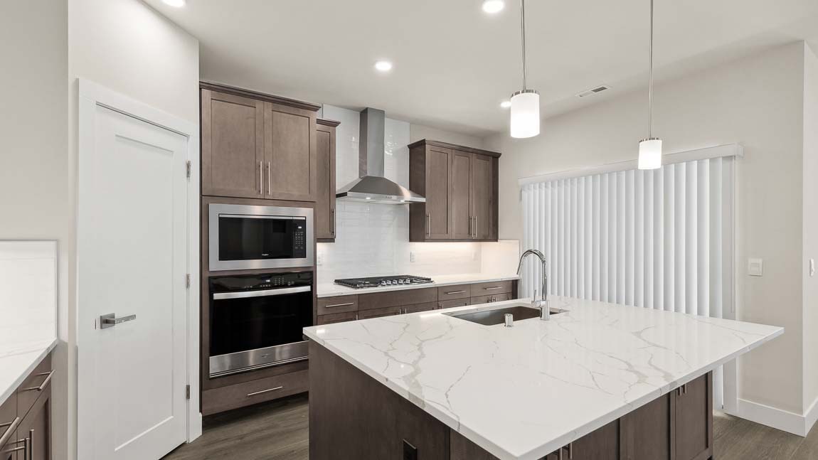 Alternate view of kitchen showing access to backyard