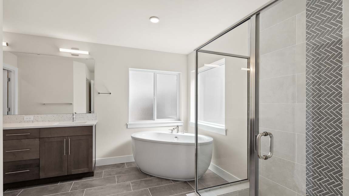 Primary bathroom offers 2 sink vanity, large step in shower and beautiful soaking tub