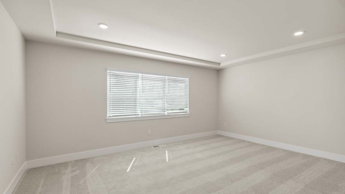 Primary bedroom suite with trace ceilings