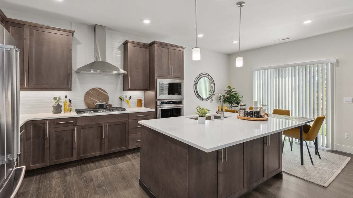 Secondary bedroom or den space on main floor, styled in model home as an office