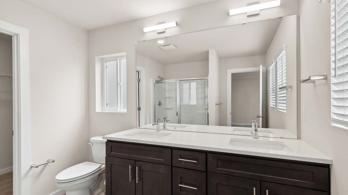 Primary bathroom featuring 2 sink vanity and oversized step in shower