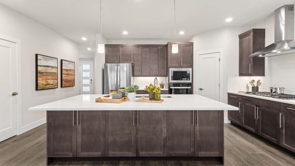 Generous kitchen island counterspace and modern appliances