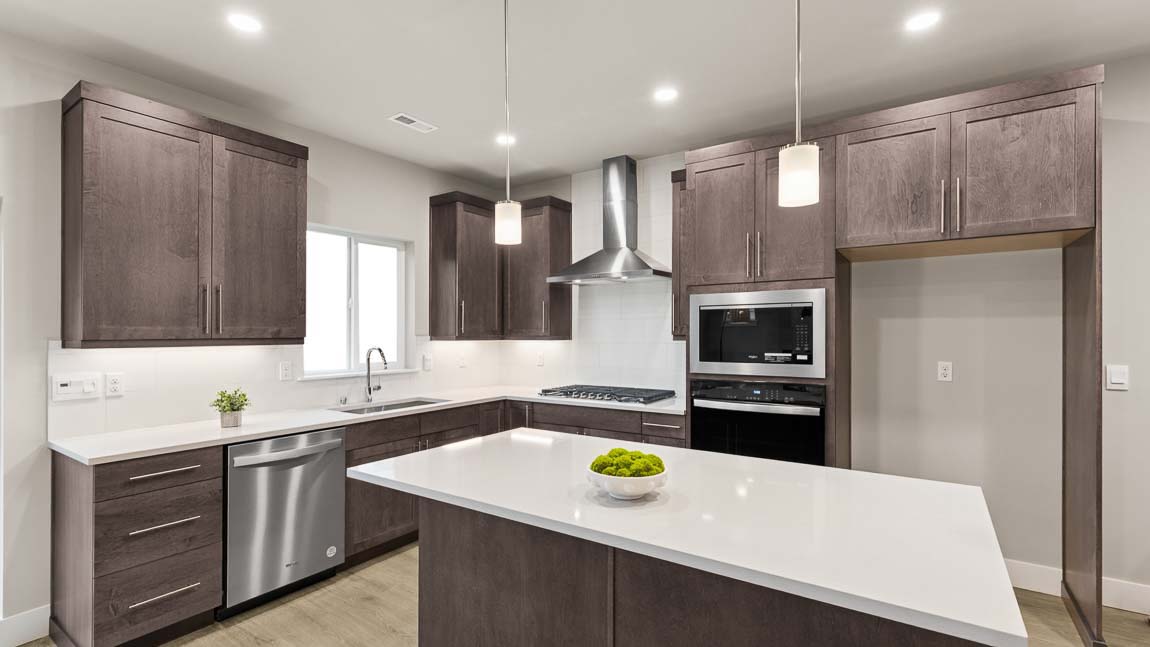Beautiful and bright kitchen with dark modern cabinetry