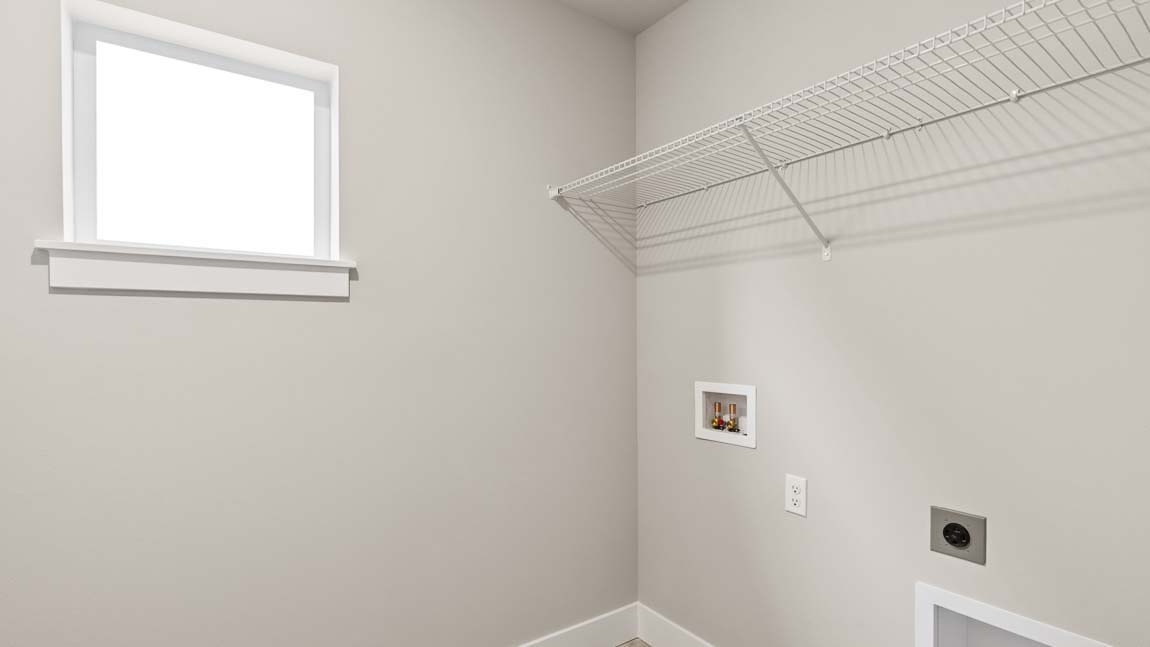 Laundry/Utility room conveniently located on the upper floor