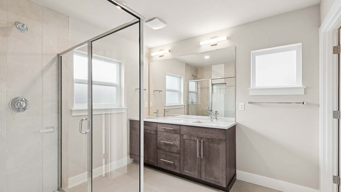 Primary bathroom featuring 2 sink vanity and large step in shower