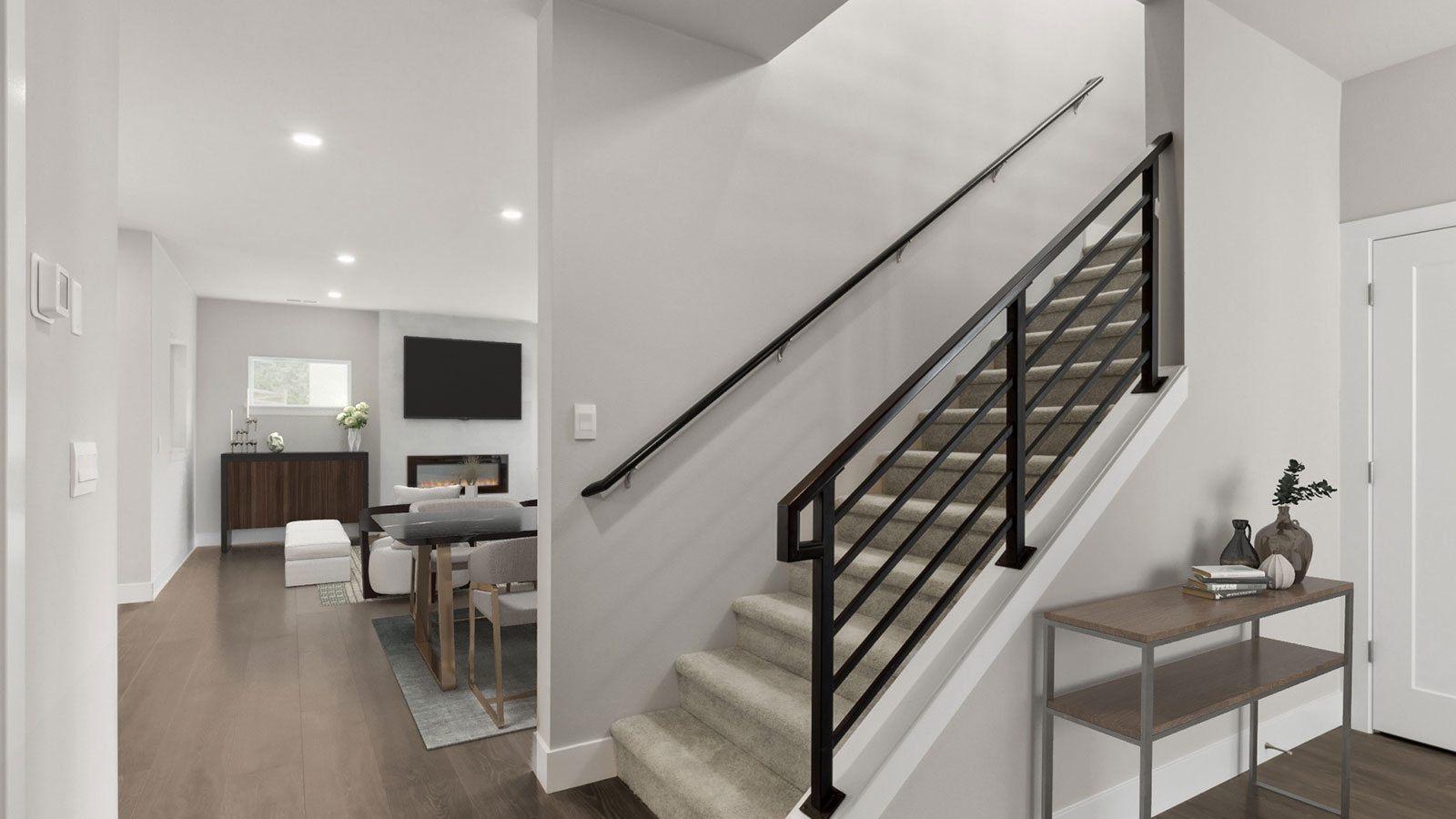 Entryway foyer with view into living room and staircase to upper floor