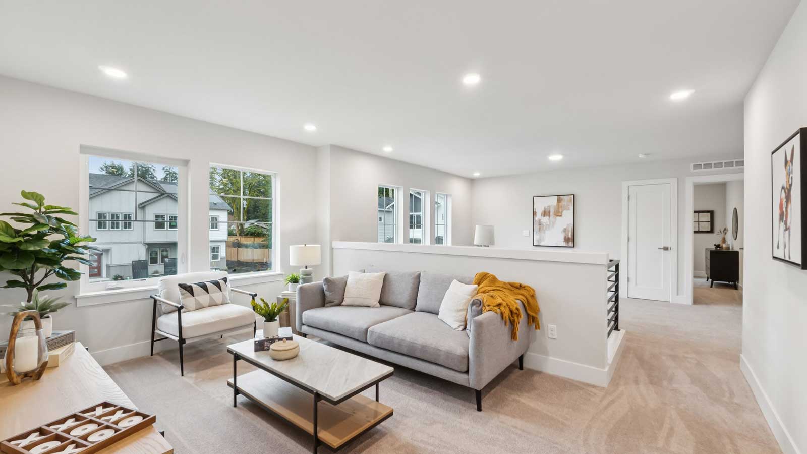 Loft space on upper floor staged as a reading nook or media room