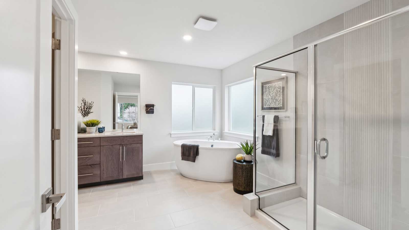 Beautiful primary bathroom with soaking tub and large step in shower