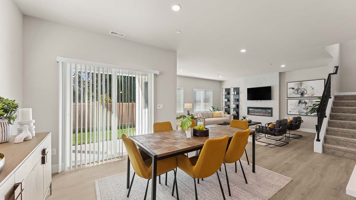 Dining room flowing into living space showcasing open concept living