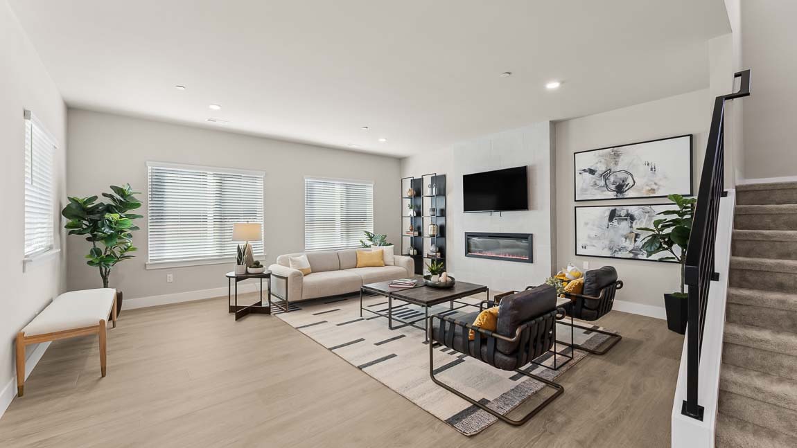 Kimball floor plan main floor great room with accent-color wall and built in fireplace with floor-to-ceiling tile