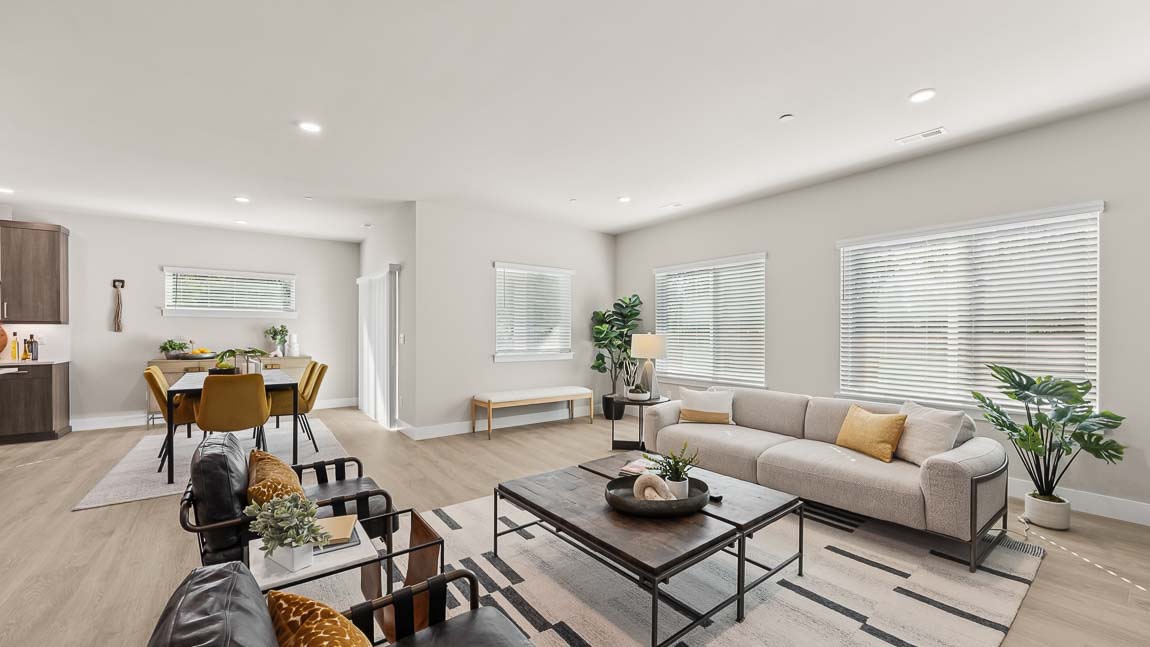 View of living room showing off large windows and natural light