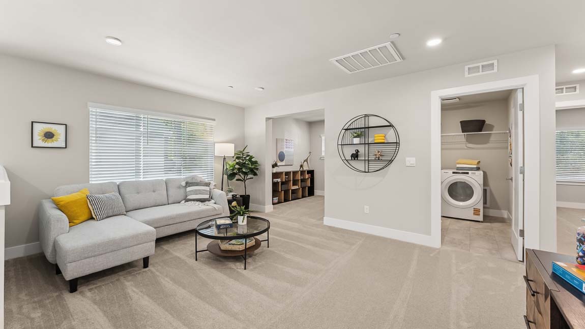 Upper floor multipurpose loft area near stairway access with adjoining tech room and easy access to laundry room