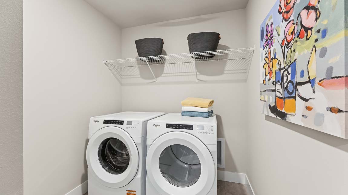Laundry-utility room with space for separate washer and dryer and storage shelf above