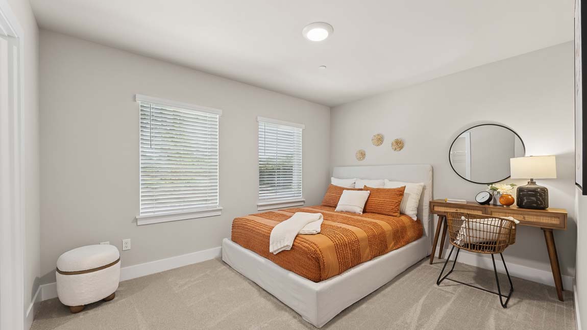 Fourth bedroom with walk-in closet near secondary bathroom on upper floor