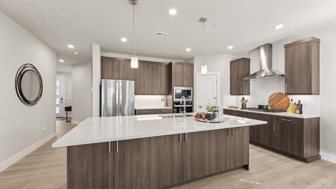 Generous kitchen island counterspace and modern appliances
