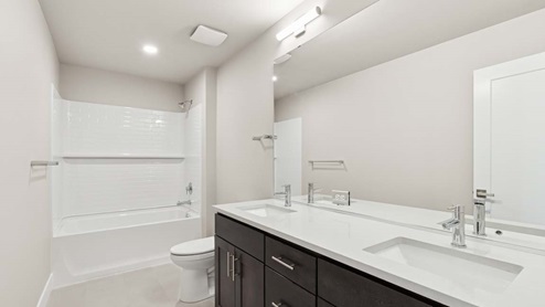 Hallway bathroom with shower tub combo