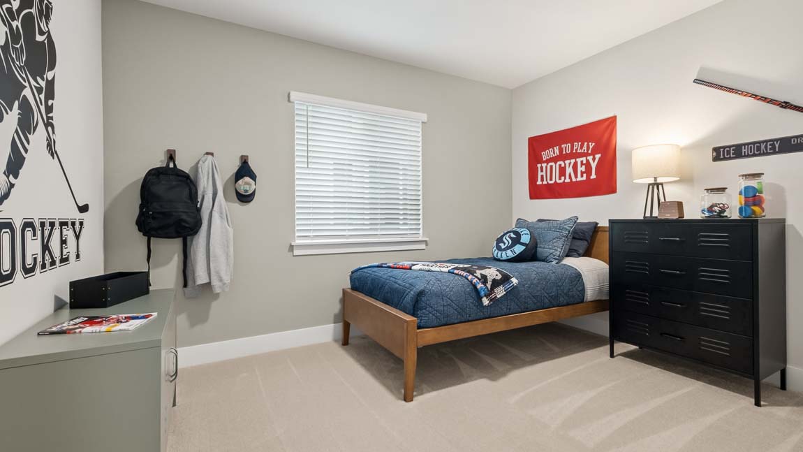secondary bedroom staged as kids bedroom