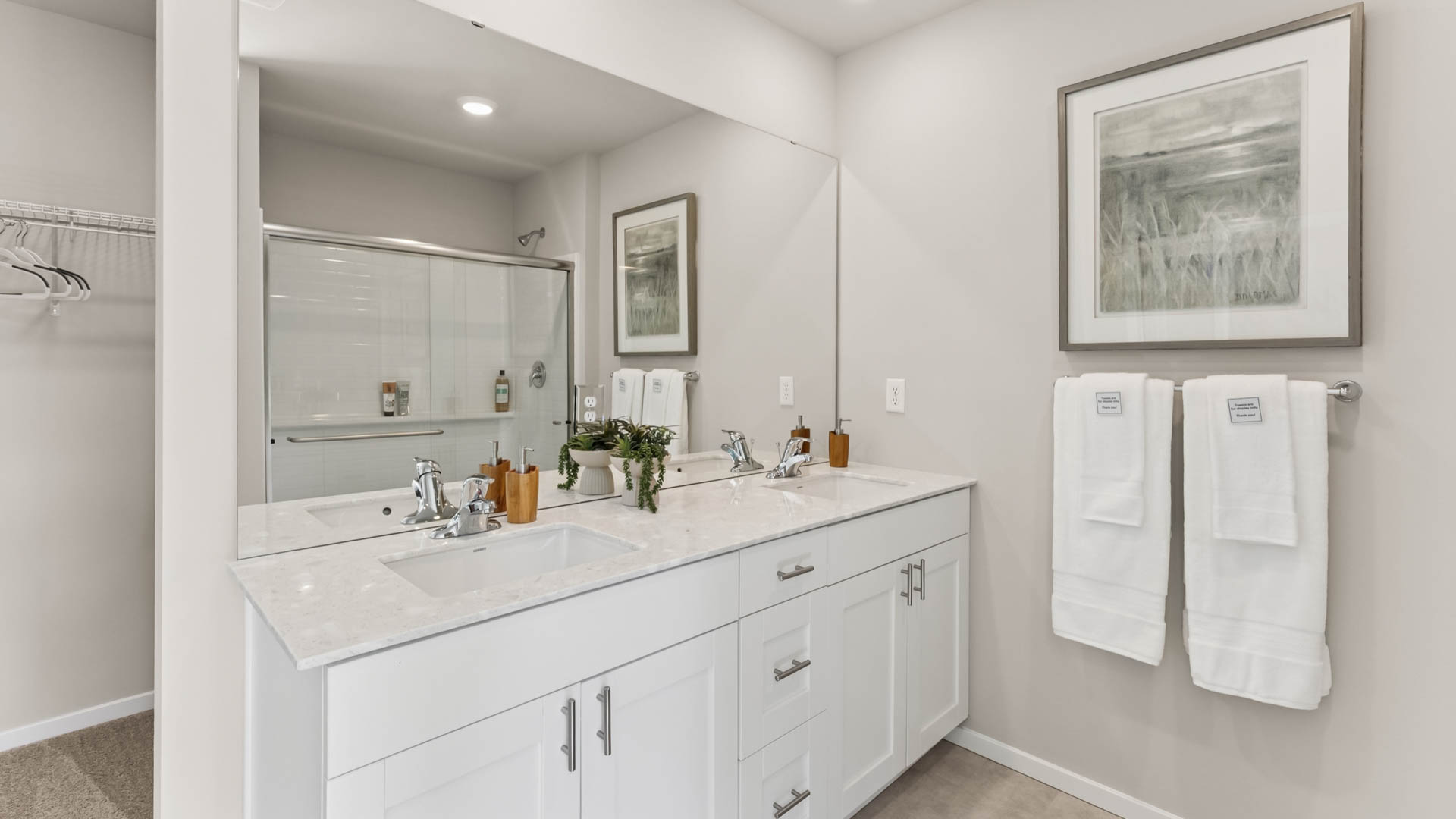 Primary bathroom featuring 2 sink vanity and large step in shower