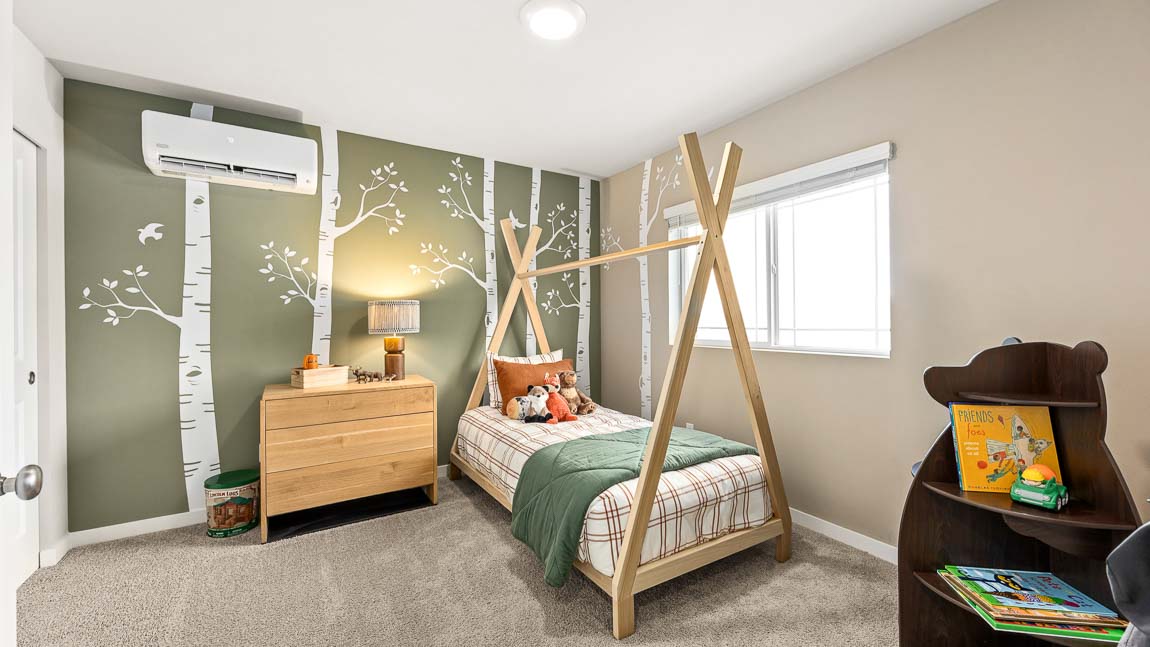 Bedroom 2 on the upper level staged as a kid’s room