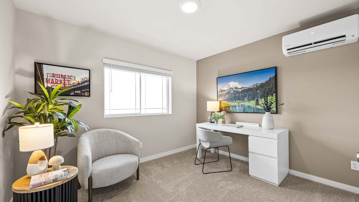Bedroom 3 on the upper level staged as a home office
