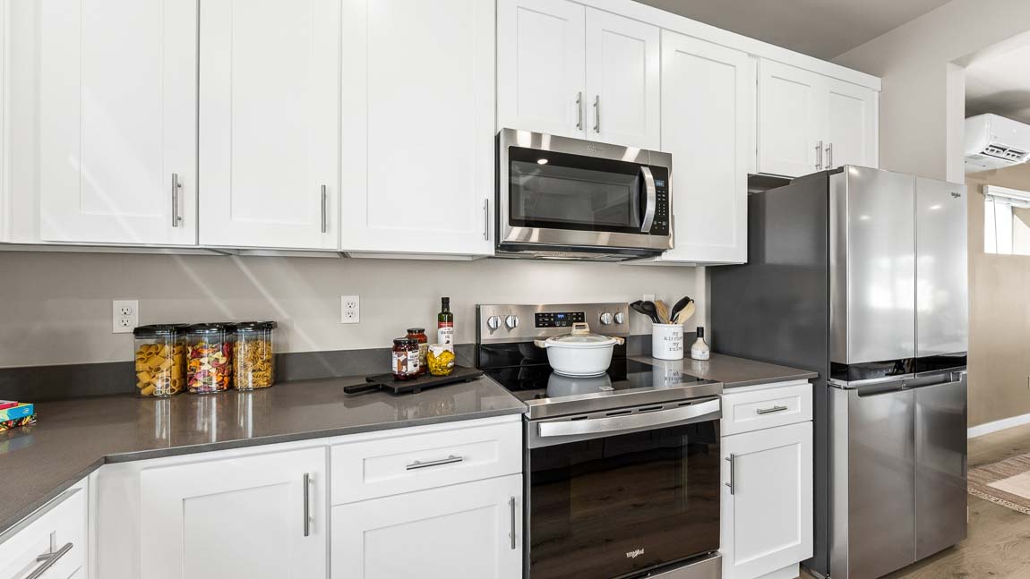 Stainless steel appliances in this beautiful kitchen