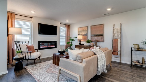 Great room with laminate flooring and an electric fireplace