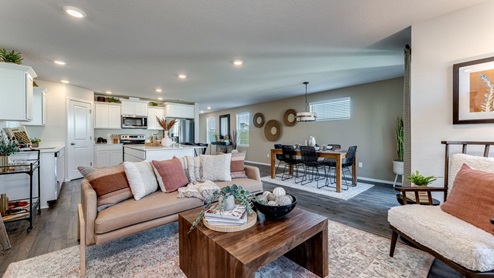 Great room with laminate flooring and an electric fireplace