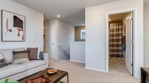 Loft area with wall-to-wall carpet