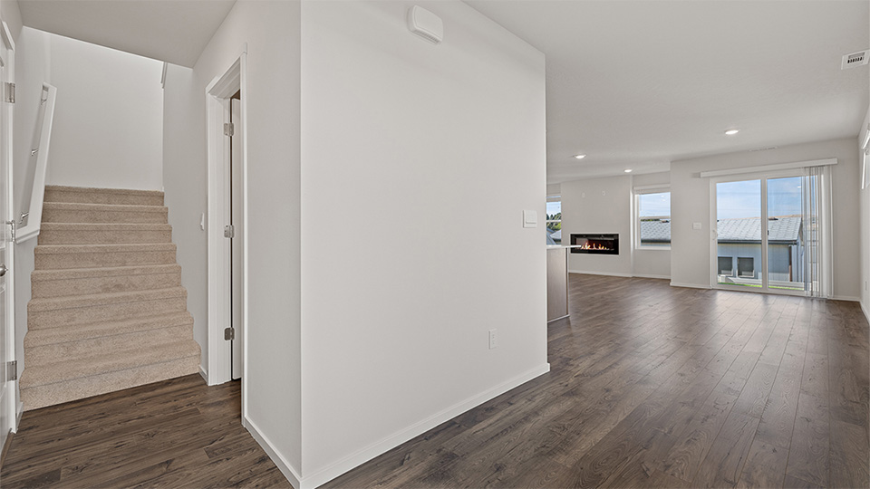 Entryway with a coat closet and laminate flooring