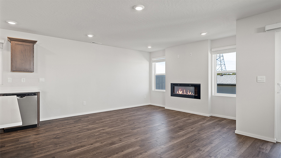 Great room with laminate flooring and an electric fireplace