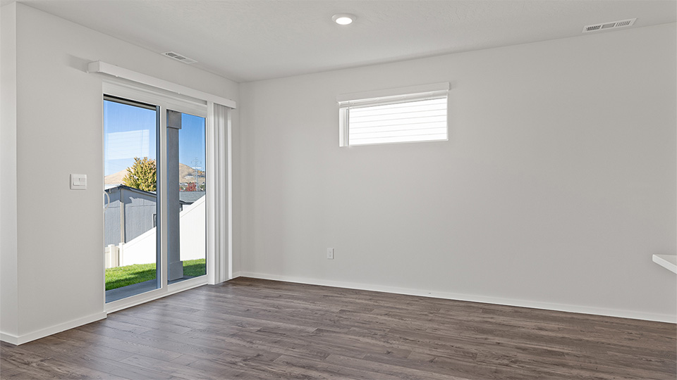 Dining area with a sliding glass door to a fenced backyard
