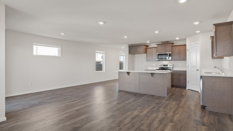 Great room with laminate flooring and an electric fireplace