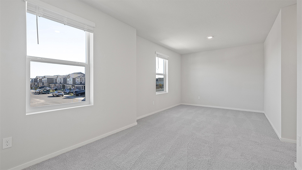 Bedroom with wall-to-wall carpet and a closet