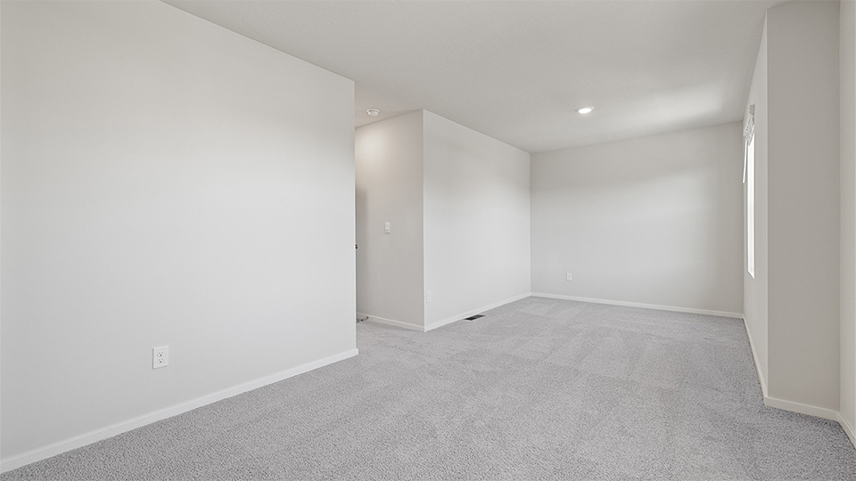 Bedroom with wall-to-wall carpet and a closet