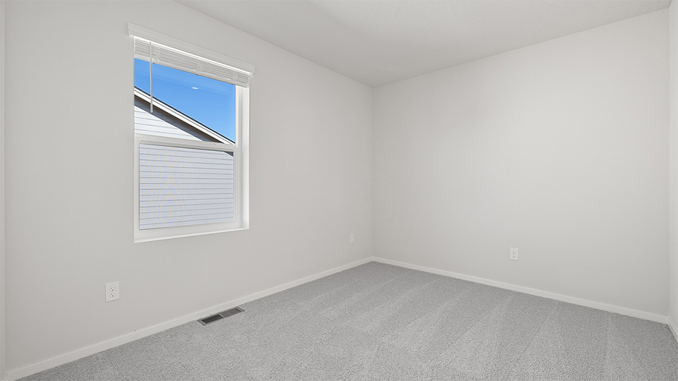 Bedroom with wall-to-wall carpet and a closet
