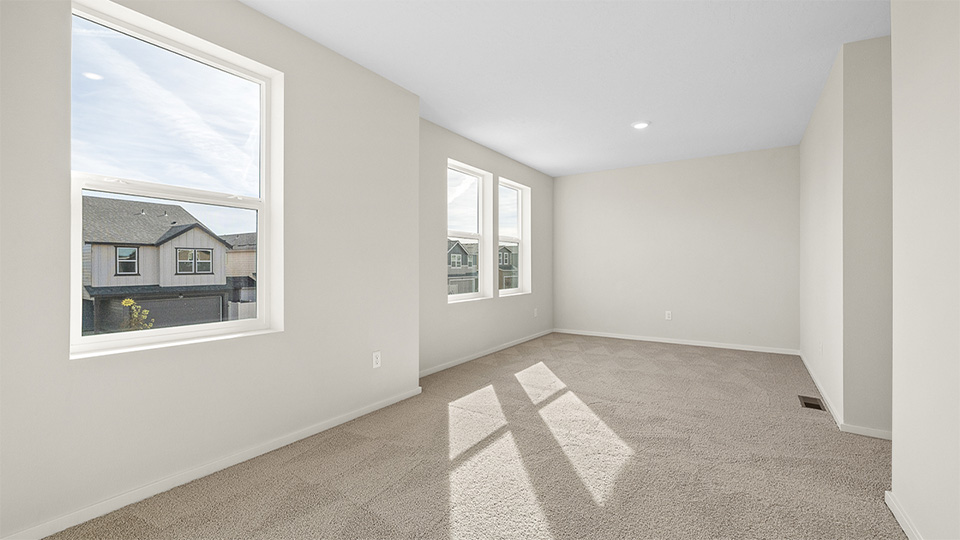 Bedroom with wall-to-wall carpet and a closet