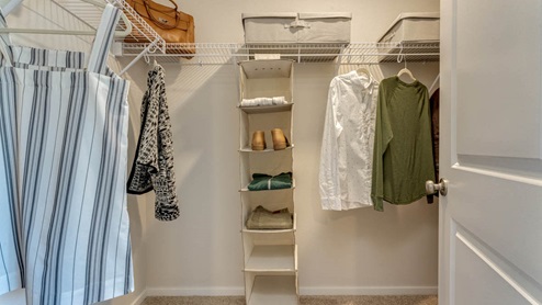 primary walk-in closet with wire shelves