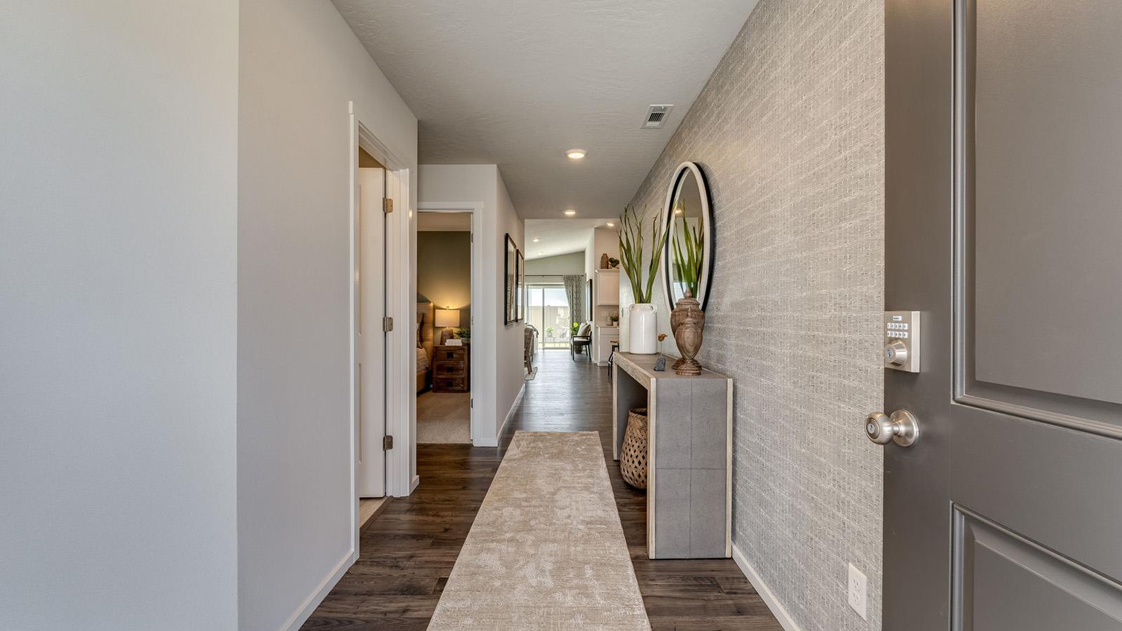 Entryway with a coat closet and laminate flooring
