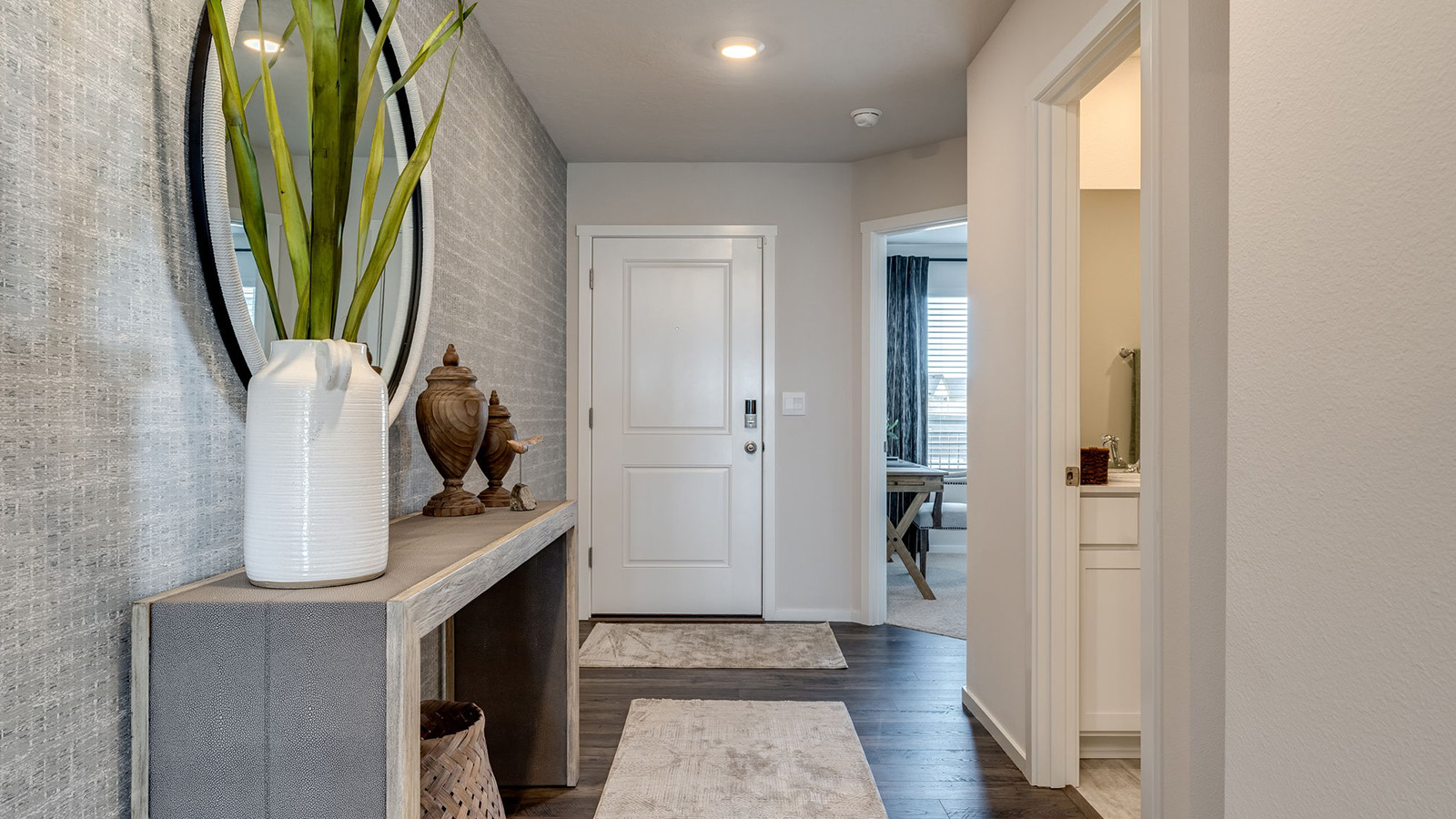 Entryway with a coat closet and laminate flooring