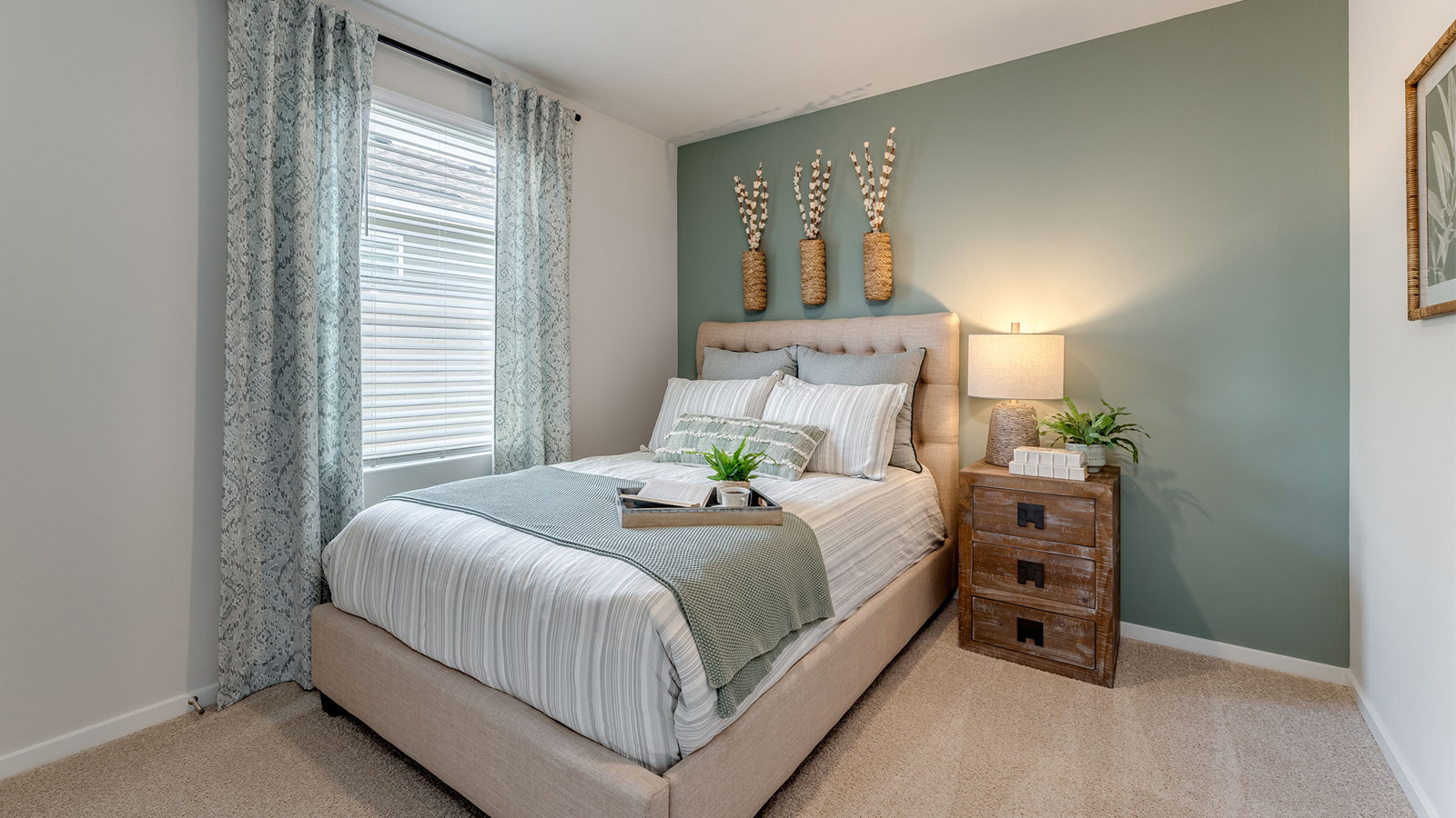 Bedroom with wall-to-wall carpet and a closet