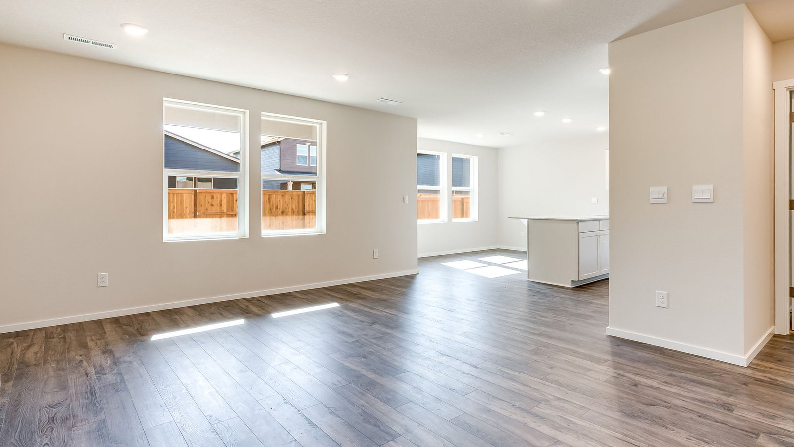Great room with laminate flooring and an electric fireplace