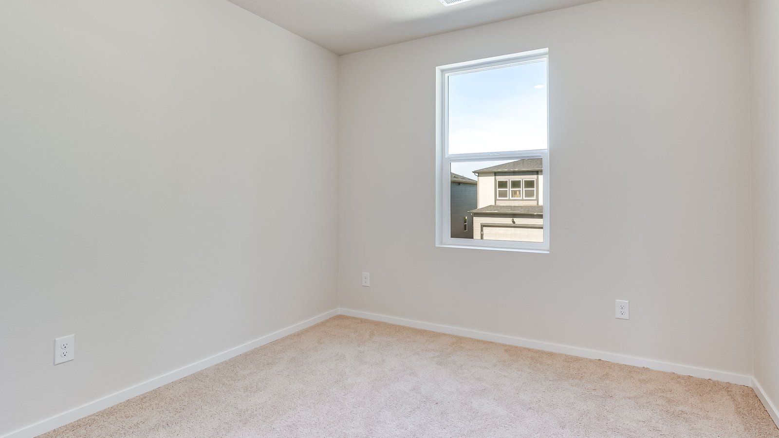 Bedroom with wall-to-wall carpet and a closet