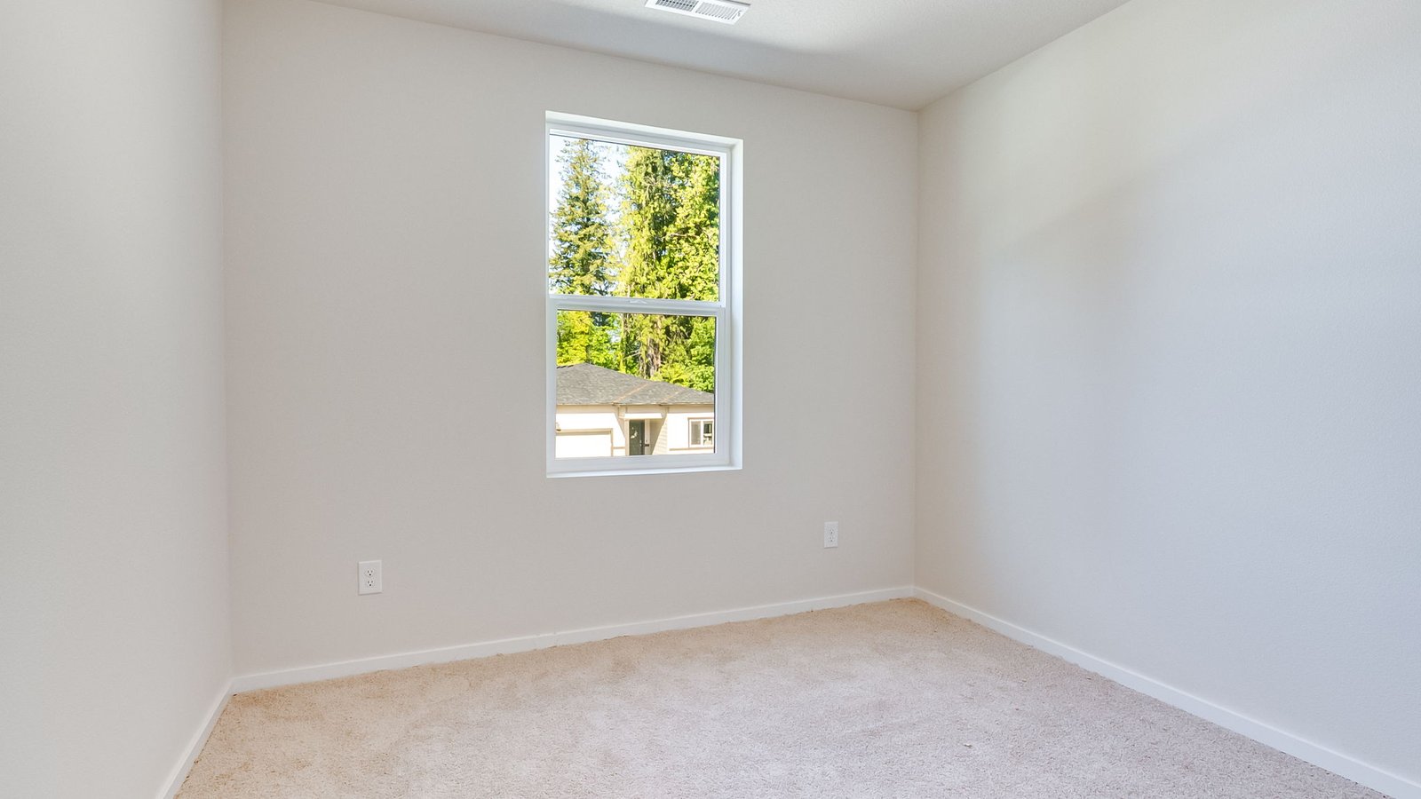 Bedroom with wall-to-wall carpet and a closet