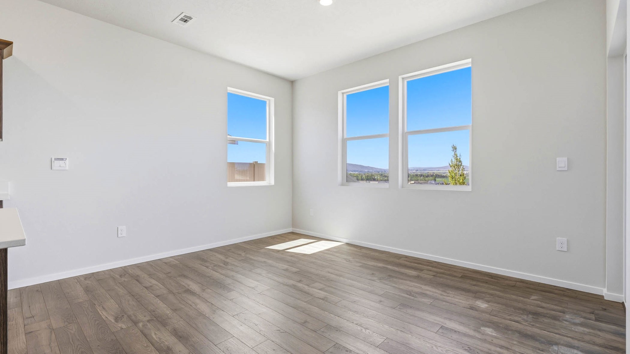 Dining area with a sliding glass door to a fenced backyard