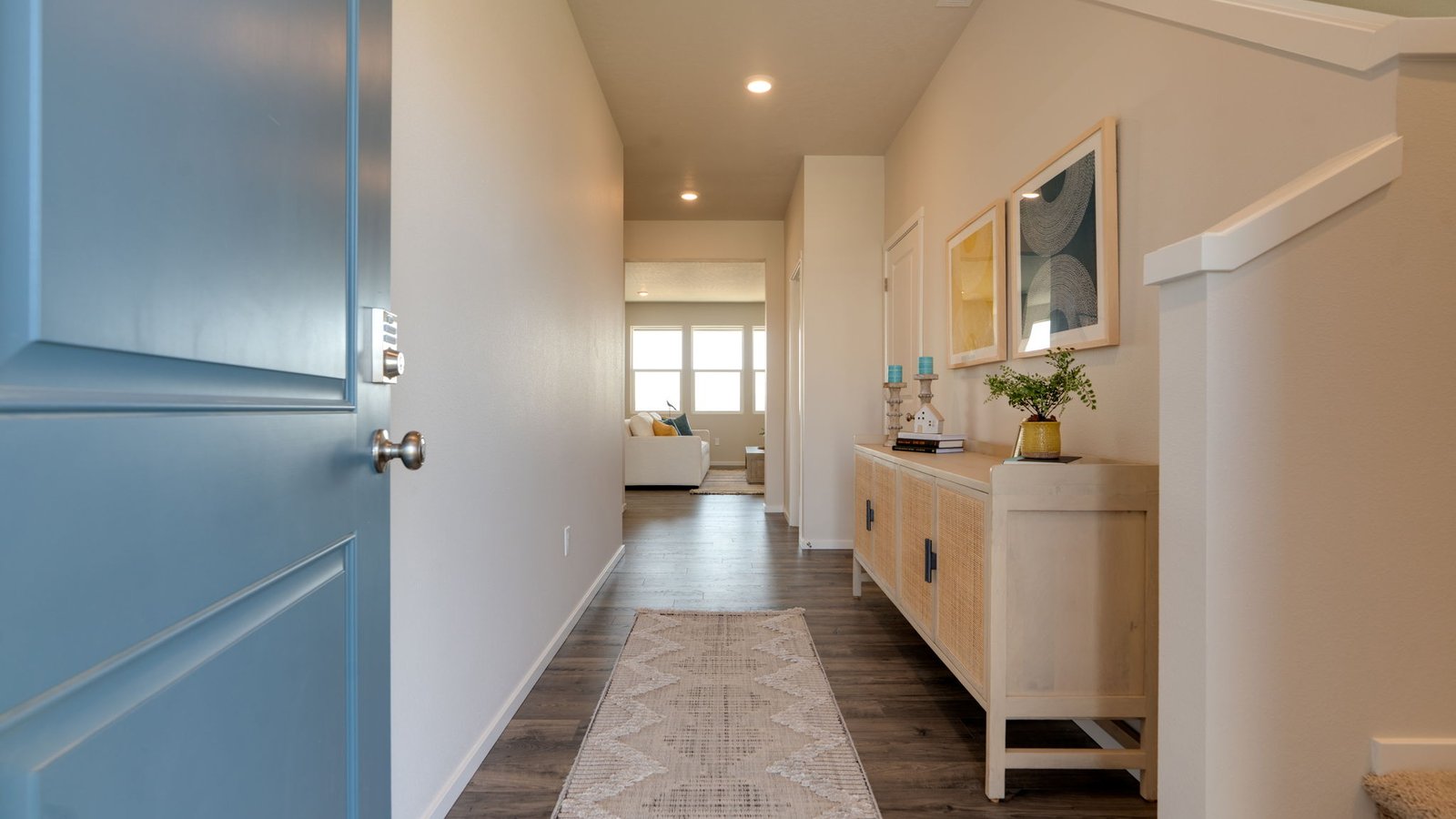 Entryway with a coat closet and laminate flooring