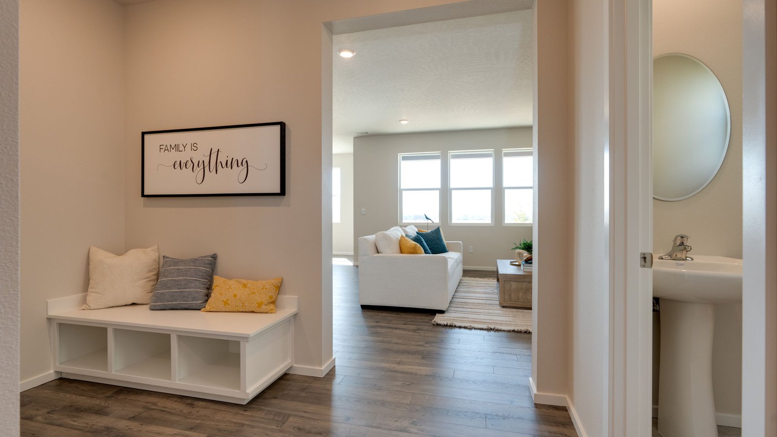 Entryway with a coat closet and laminate flooring