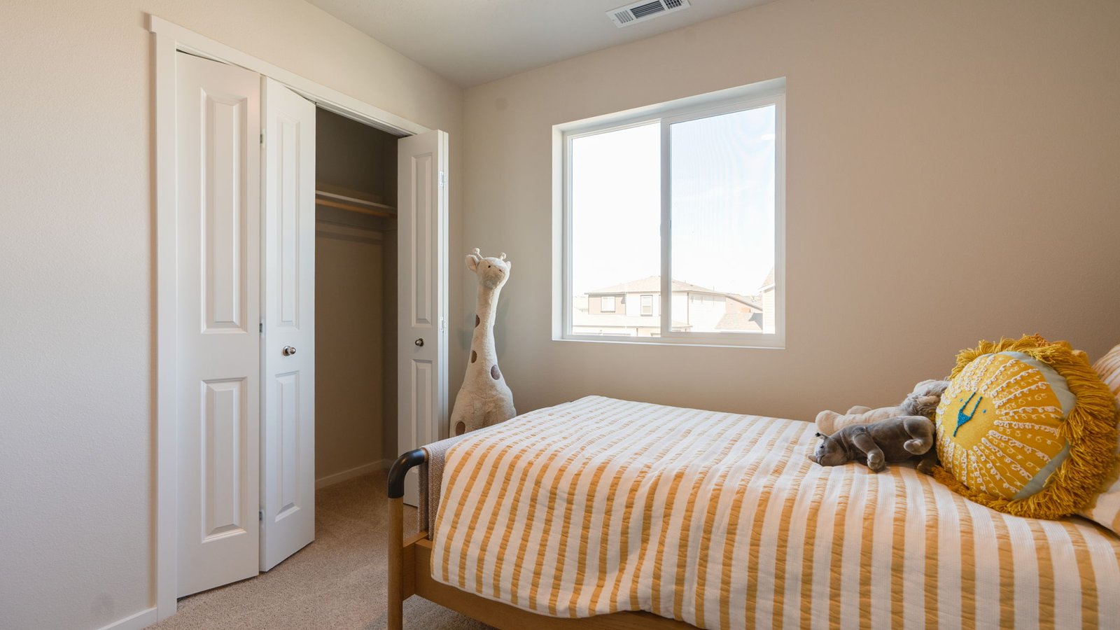 Bedroom with wall-to-wall carpet and a closet